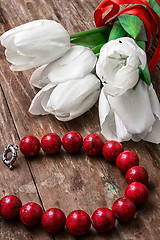 Image showing tulips and womens coral beads