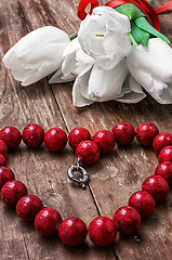 Image showing tulips and womens coral beads