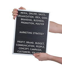Image showing Marketing strategy concept in plastic letters on very old menu b