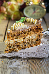 Image showing Piece of walnut cake with cream close-up.