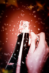 Image showing Opening champagne bottle