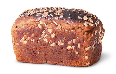 Image showing Unleavened black bread with nuts seeds and dried fruit rotated