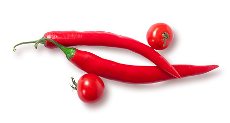 Image showing Two chili pepper and two cherry tomatoes top view