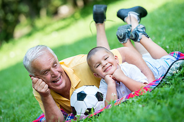 Image showing grandfather and child have fun  in park