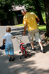 Image showing grandfather and child have fun  in park