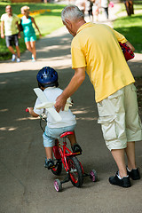 Image showing grandfather and child have fun  in park