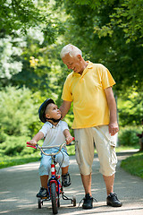 Image showing grandfather and child have fun  in park