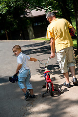 Image showing grandfather and child have fun  in park