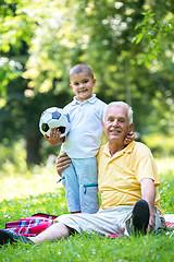 Image showing grandfather and child have fun  in park