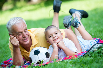 Image showing grandfather and child have fun  in park