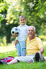 Image showing grandfather and child have fun  in park