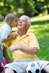 Image showing grandfather and child have fun  in park