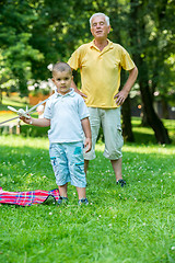 Image showing grandfather and child have fun  in park