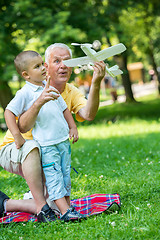 Image showing grandfather and child have fun  in park