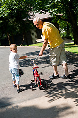 Image showing grandfather and child have fun  in park