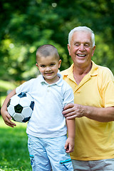 Image showing grandfather and child have fun  in park