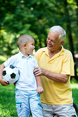 Image showing grandfather and child have fun  in park