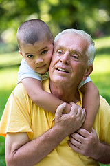 Image showing grandfather and child have fun  in park