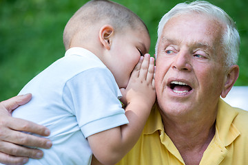 Image showing grandfather and child have fun  in park