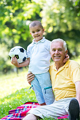 Image showing grandfather and child have fun  in park