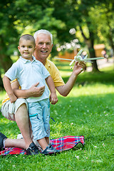 Image showing grandfather and child have fun  in park