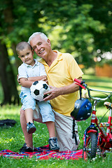 Image showing grandfather and child have fun  in park