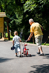 Image showing grandfather and child have fun  in park