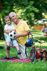 Image showing grandfather and child have fun  in park