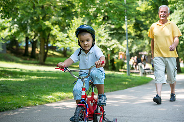 Image showing grandfather and child have fun  in park