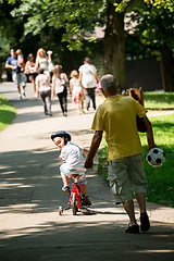 Image showing grandfather and child have fun  in park