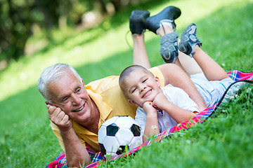 Image showing grandfather and child have fun  in park