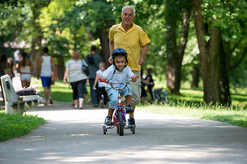 Image showing grandfather and child have fun  in park