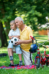 Image showing grandfather and child have fun  in park