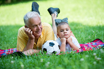 Image showing grandfather and child have fun  in park