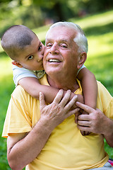 Image showing grandfather and child have fun  in park