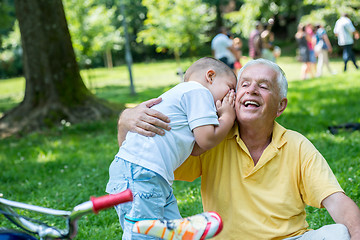 Image showing grandfather and child have fun  in park