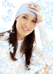 Image showing lovely brunette in winter hat with snowflakes #2