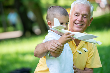 Image showing grandfather and child have fun  in park