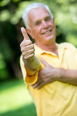 Image showing grandfather and child in park using tablet