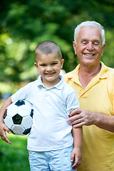 Image showing grandfather and child have fun  in park