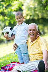 Image showing grandfather and child have fun  in park