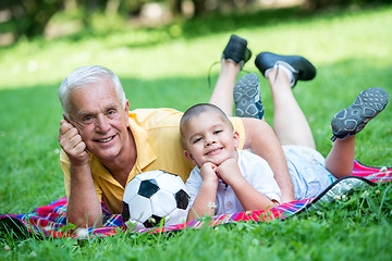 Image showing grandfather and child have fun  in park