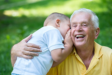 Image showing grandfather and child have fun  in park