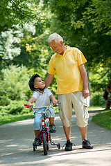 Image showing grandfather and child have fun  in park