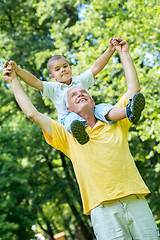 Image showing grandfather and child have fun  in park