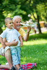 Image showing grandfather and child have fun  in park