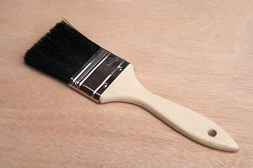 Image showing Paint brush on wood background