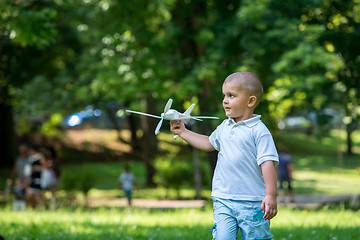 Image showing boy with airpane toy