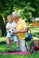 Image showing grandfather and child have fun  in park