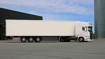 Image showing White Semi Trailer Truck on a Warehouse Yard